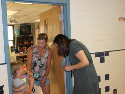 Students in Ms. Bosman's  class visit her.